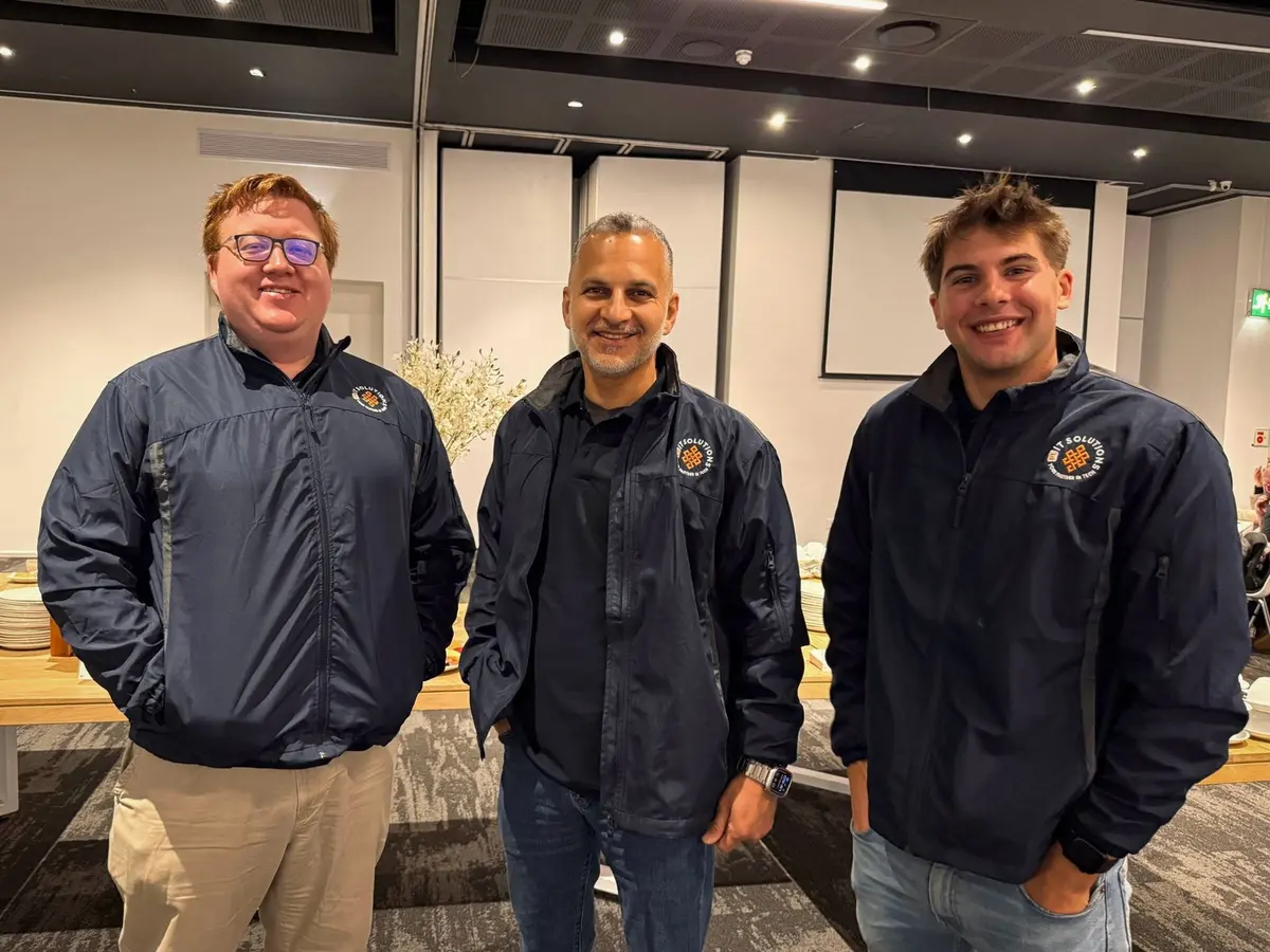 The F1 IT Solutions team — Lèo Liebenberg with colleagues Reza and Christiaan.